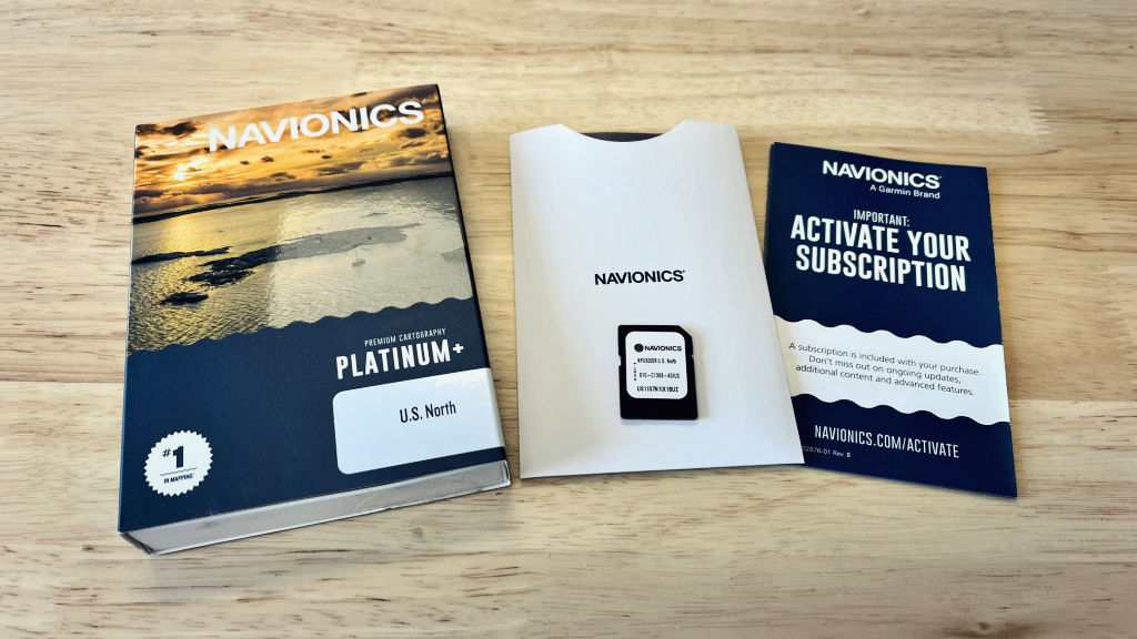 Navionics Platinum Plus map cards unboxed on table.